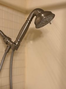 Cold water blasting out of a polished nickel hand held shower head when you have a broken hot water heater